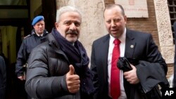 FILE - Reggio Calabria head of Police Guido Longo (L) gives the thumbs up next to FBI special agent Leo Taddeo following a joint Italian-U.S. authorities' press conference on an anti-Mafia blitz with numerous arrests reported on both sides of the Atlantic, Rome.