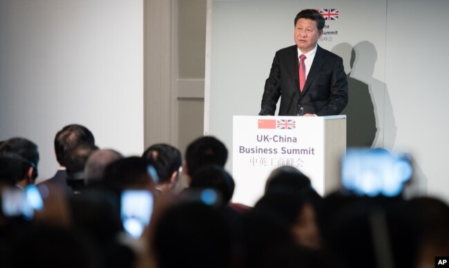 FILE - China's President Xi Jinping addresses guests and delegates at the UK-China Business Summit in Mansion House, central London, Oct. 21, 2015. China agreed to put down a 6 billion-pound ($9.3 billion) stake in the U.K.'s first nuclear power plant since the 1980s.
