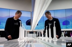 Hansjoerg Reick looks at a display of Oral-B Genius X smart toothbrushes at the Procter & Gamble booth before CES International, Monday, Jan. 7, 2019, in Las Vegas.