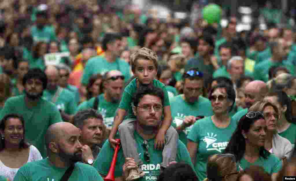 Protesters march during a rally in support of striking teachers in Palma, on the Spanish island of Mallorca. Teachers have been on an indefinite strike since the start of the school year in protest of a law to implement trilingualism (Catalan, Spanish and English) in schools.