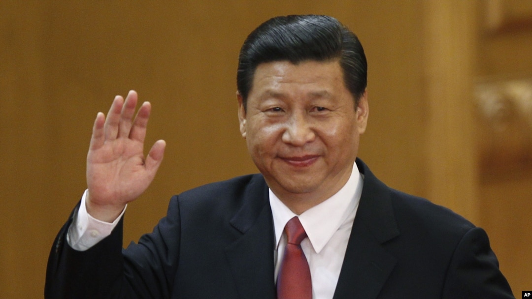 New Communist Party General Secretary Xi Jinping waves in Beijing's Great Hall of the People Nov. 15, 2012.