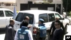 This image made from video made available by Syrian TV shows United Nations observers during a visit to Homs, Syria, April 21, 2012.