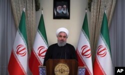 伊朗总统办公室官方网站发布的照片显示，哈桑·鲁哈尼总统2018年5月8日在伊朗德黑兰发表电视讲话。