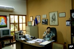 In this July 24, 2018 photo, Vilma Nunez, president of Nicaraguan Center for Human Rights talks on a phone, at her office in Managua, Nicaragua.