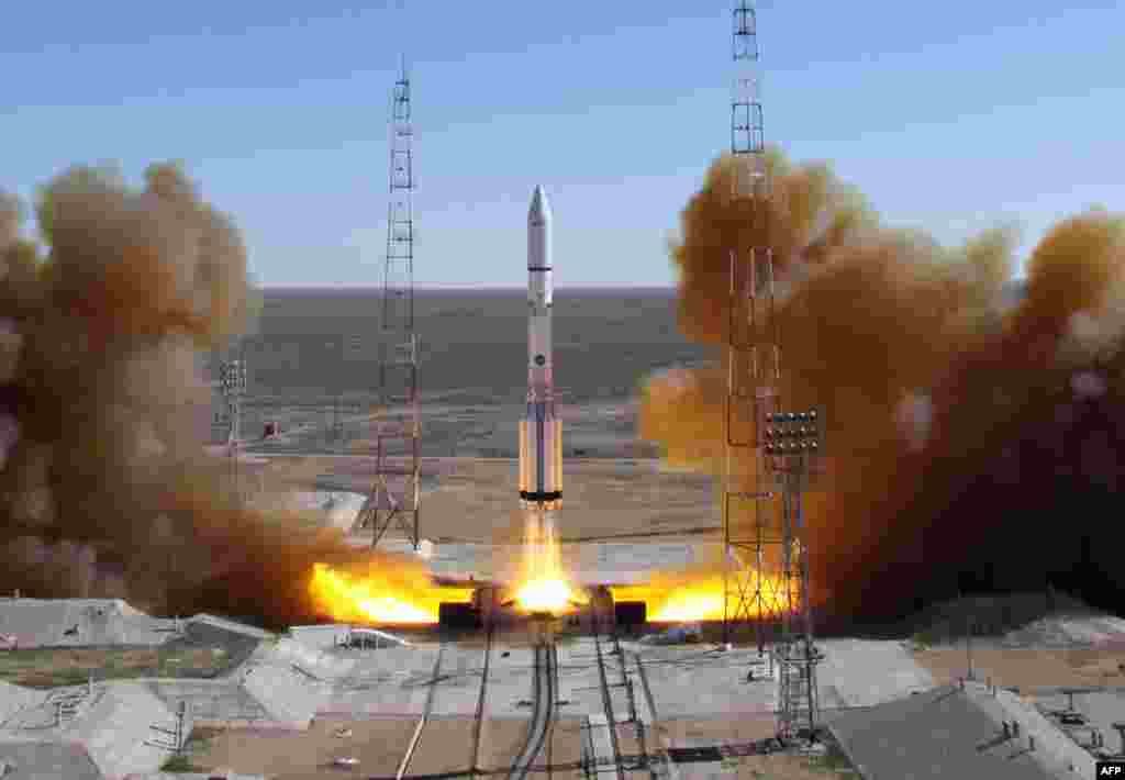 A Russian-built Proton rocket with Russian relay satellite Luch-5V and the Kazakh communication satellite KazSat-3 aboard blasts off from a launch pad in the Russian-leased Kazakhstan&#39;s Baikonur cosmodrome.