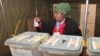 FILE - A woman casts her vote in presidential and parliamentary elections in Zimbabwe's capital, Harare, July, 31, 2013. Four women are among the presidential candidates seeking election on Monday.