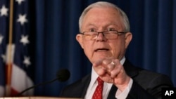FILE -U.S. Attorney General Jeff Sessions delivers remarks about defending national security, at the U.S. attorney's office for the Southern District of New York, Nov. 2, 2017. On Nov. 16, Sessions touted recent arrests as an important step in the Trump administration's effort to stamp out the transnational MS-13 gang. 