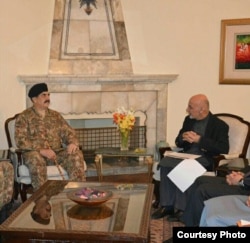 FILE - This picture released by Pakistan's army shows General Raheel Sharif meeting with Afghan President Ashraf Ghani, Dec. 27, 2015.