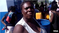 This woman told VOA Creole she's been back to the water kiosk three times today and is grateful to have access to fresh water in Gonaives, northern Haiti. (Photo: Exalus Mergenat / VOA Creole)
