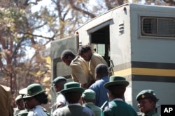 file: Suspected demonstrators make a court appearance in Harare, Zimbabwe, Aug. 29, 2016.