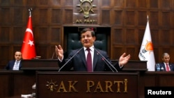 Turkish Prime Minister Ahmet Davutoglu addresses lawmakers from his ruling AK Party (AKP) at the Turkish parliament in Ankara January 6, 2015.