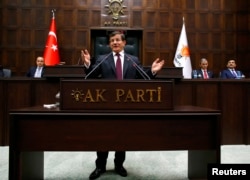 FILE - Turkish Prime Minister Ahmet Davutoglu addresses lawmakers from his ruling AK Party (AKP) at the Turkish parliament in Ankara January 6, 2015.