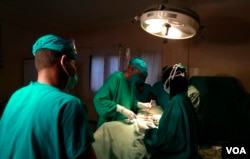 FILE - Doctors are seen operating on a cancer patient at a Nairobi hospital. The Kenya Cancer Association says it is getting reports of three deaths a week — a 50 percent increase compared to this time last year. (R. Ombuor/VOA)