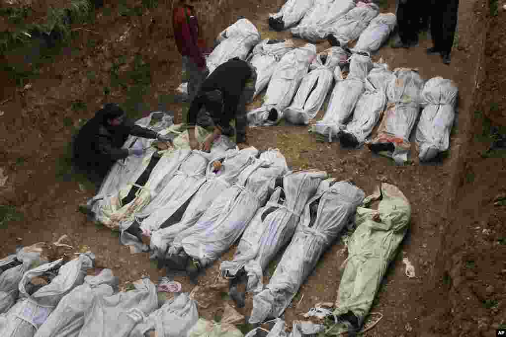 The bodies of dozens of men, many of them with their hands bound behind their backs, were found on the muddy banks of a small river January 29, 2013 in the northern city of Aleppo.