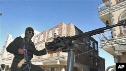 A Yemeni policeman guards the state security court in San'a, Yemen, as that nation's government puts US-born radical cleric Anwar al-Awlaki on trial in absentia, 02 Nov 2010