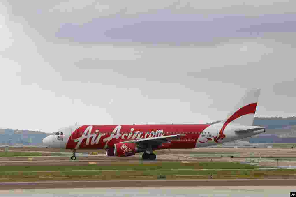 FILE - In this Nov. 26, 2014, photo, an AirAsia Airbus A320 is seen taxiing on the tarmac in Sepang, Malaysia.