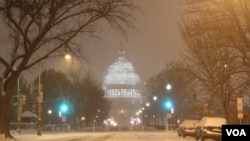 The illuminated dome of the US Capitol could be seen through the wind-blown snow in Northeast Washington (P. Datcher/VOA)