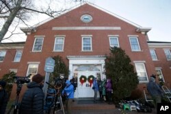 Members of the news media stand outside the Nantucket Town & County Building, awaiting arrival of actor Kevin Spacey for arraignment on a charge of indecent assault and battery, Jan. 7, 2019, in Nantucket, Massachusetts.