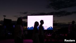 People celebrate New Year's Eve on the Yarra River waterfront, as the Omicron variant of the coronavirus disease (COVID-19) continues to spread, in Melbourne, Australia, Dec. 31, 2021.