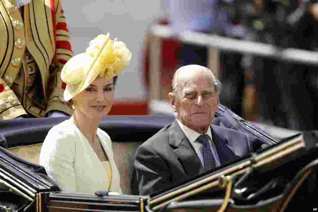Spain's Queen Letizia and Britain's Prince Philip sit together in a carriage as they are taken to Buckingham Palace after a Ceremonial Welcome on Horse Guards Parade in London.