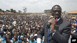 Uganda's opposition leader Kizza Besigye speaks during a rally at Rubaga division in the capital Kampala, Uganda, February 14, 2011