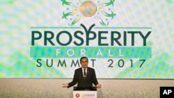 FILE - Thailand's PM Prayuth Chan-ocha gestures during his speech at the "Prosperity For All" Summit, the parallel event of the 30th ASEAN Leaders' Summit at metropolitan Manila, Philippines, April 28, 2017. 