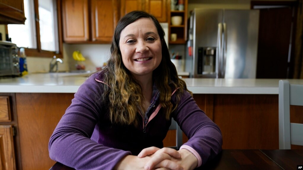 Waukee School District teacher Liz Wagner in her home, Dec. 23, 2021, in Urbandale, Iowa. Teachers have already landed on the front lines of the "culture war." The January 6th incident is no different. (AP Photo/Charlie Neibergall)