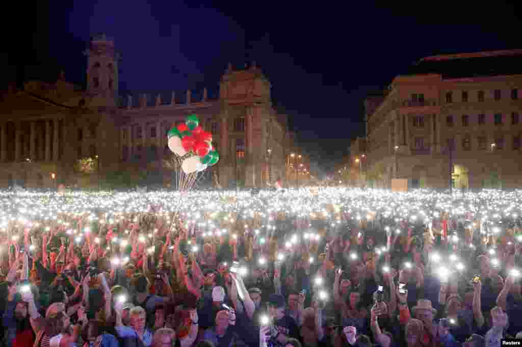 People attend a protest against the government of Prime Minister Viktor Orban in Budapest, Hungary, April 14, 2018.