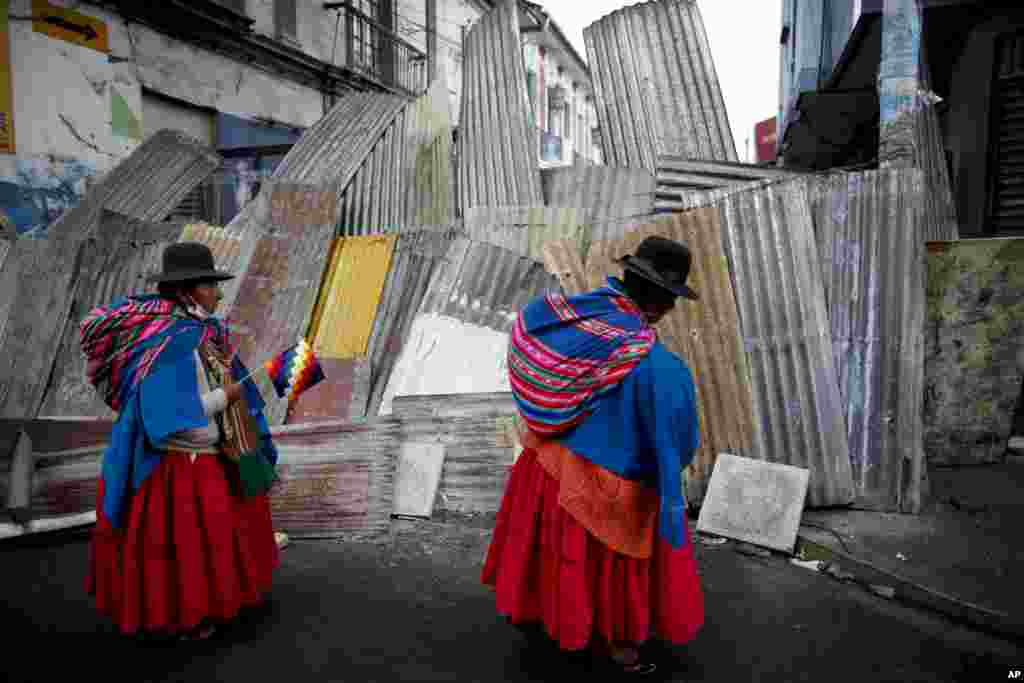 Supporters of former President Evo Morales march to the presidential palace in La Paz, Bolivia. Morales resigned and flew to Mexico under military pressure following massive nationwide protests over alleged fraud in an election last month in which he claimed to have won a fourth term in office.