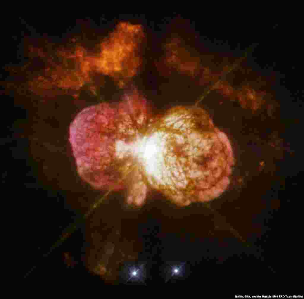 Eta Carinae&#39;s great eruption in the 1840s created the billowing Homunculus Nebula, imaged here by Hubble, and transformed the binary into a unique object in our galaxy. Astronomers cannot yet explain what caused this eruption. The discovery of likely Eta Carinae twins in other galaxies will help scientists better understand this brief phase in the life of a massive star.