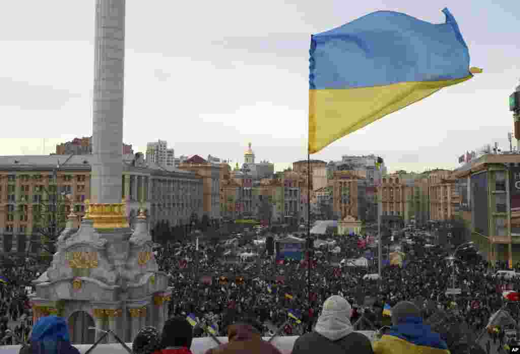 A Ukrainian flag is seen above a rally in Independence Square in Kyiv, Dec. 3, 2013.