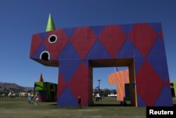 People arrive on the opening day of the Coachella Valley Music and Arts Festival in Indio, California, April 14, 2017.