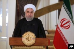 FILE - President Hassan Rouhani addresses the nation, in Tehran, Iran, Oct. 13, 2017.