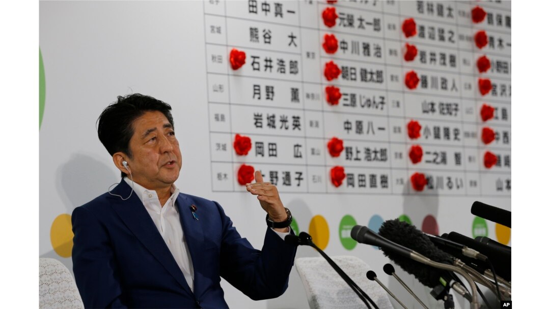 Japan's Prime Minister Shinzo Abe, leader of the Liberal Democratic Party, answers a question from reporters at their party headquarters in Tokyo, July 10, 2016.