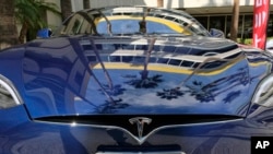 FILE - A Tesla Model S on display in downtown Los Angeles, Oct. 24, 2016. Tesla Motors fired hundreds of workers after completing its annual performance reviews, even though the electric automaker is trying to ramp up production to meet the demand for its new Model 3 sedan.