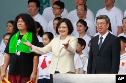 New Taiwan's President Tsai Ing-wen, center, and Vice President Chen Chien-jen, right, attend their inauguration ceremonies in Taipei, Taiwan, May 20, 2016.