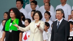 New Taiwan's President Tsai Ing-wen, center, and Vice President Chen Chien-jen, right, attend their inauguration ceremonies in Taipei, Taiwan, Friday, May 20, 2016.