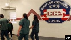 Immigrant detainees walk halls of the T. Don Hutto Residential Center, a Corrections Corporation of America immigration facility in Taylor, Texas, Feb. 9, 2007.