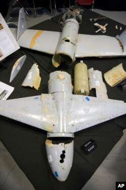 FILE - The remains of an Iranian Qasef-1 Unmanned Aerial Vehicle, a warhead-carrying weapon used to dive on targets, are shown during a press briefing at Joint Base Anacostia-Bolling, Dec. 14, 2017, in Washington. This drone was fired by Yemen into Saudi