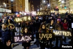 Protesters demonstrate in Lower Manhattan in New York City, demanding justice for the death of Eric Garner, Dec. 4, 2014.