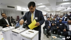 Lalit Bhanot, who was recently elected as the secretary general of the Indian Olympic Association (IOA), casts his ballot for the election of Vice President, Joint Secretary and Executive Council members of IOA in New Delhi, India, December 5, 2012.