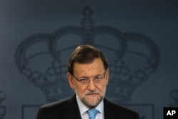 Spain's Prime Minister Mariano Rajoy listens to a question during a news conference at the Moncloa Palace, the premier's official resident, in Madrid, Nov. 11, 2015.