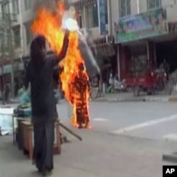 Still image of Tibetan Palden Choetso's self-immolatation.