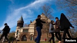 People walk around the Princeton University campus in New Jersey.