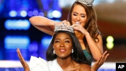 Miss New York Nia Franklin reacts after being named Miss America 2019, as she is crowned by last year's winner Cara Mund, Sept. 9, 2018, in Atlantic City, N.J.
