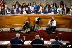 From left, Secretary of State John Kerry, Secretary of Energy Ernest Moniz and Secretary of Treasury Jack Lew testify at a Senate Foreign Relations Committee hearing to review the Iran nuclear agreement, in Washington, July 23, 2015.