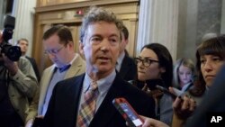 Sen. Rand Paul, R-Ky., is pursued by reporters on Capitol Hill in Washington, April 7, 2017.