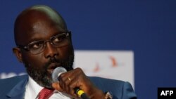 Le président libérien George Weah lors de sa visite au Conservatoire des Arts et Métiers, à Paris, le 20 février 2018. (Photo: FRANCOIS GUILLOT / AFP)