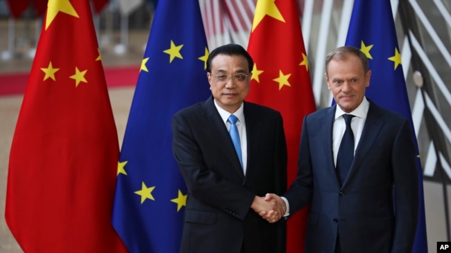 China's Premier Li Keqiang, left, shakes hands with European Council President Donald Tusk during an EU-China summit at the European Council headquarters in Brussels, Belgium, April 9, 2019.