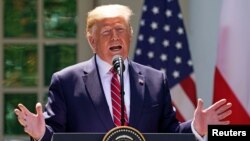 Presiden AS Donald Trump dalam konferensi pers bersama dengan Presiden Polandia Andrzej Duda (tak tampak dalam foto) di Gedung Putih, 12 Juni 2019.